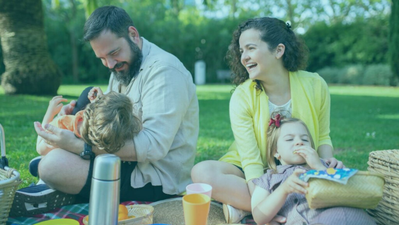 family watching from an outside cinema renting on a family loving vacation rental of Bennington Properties