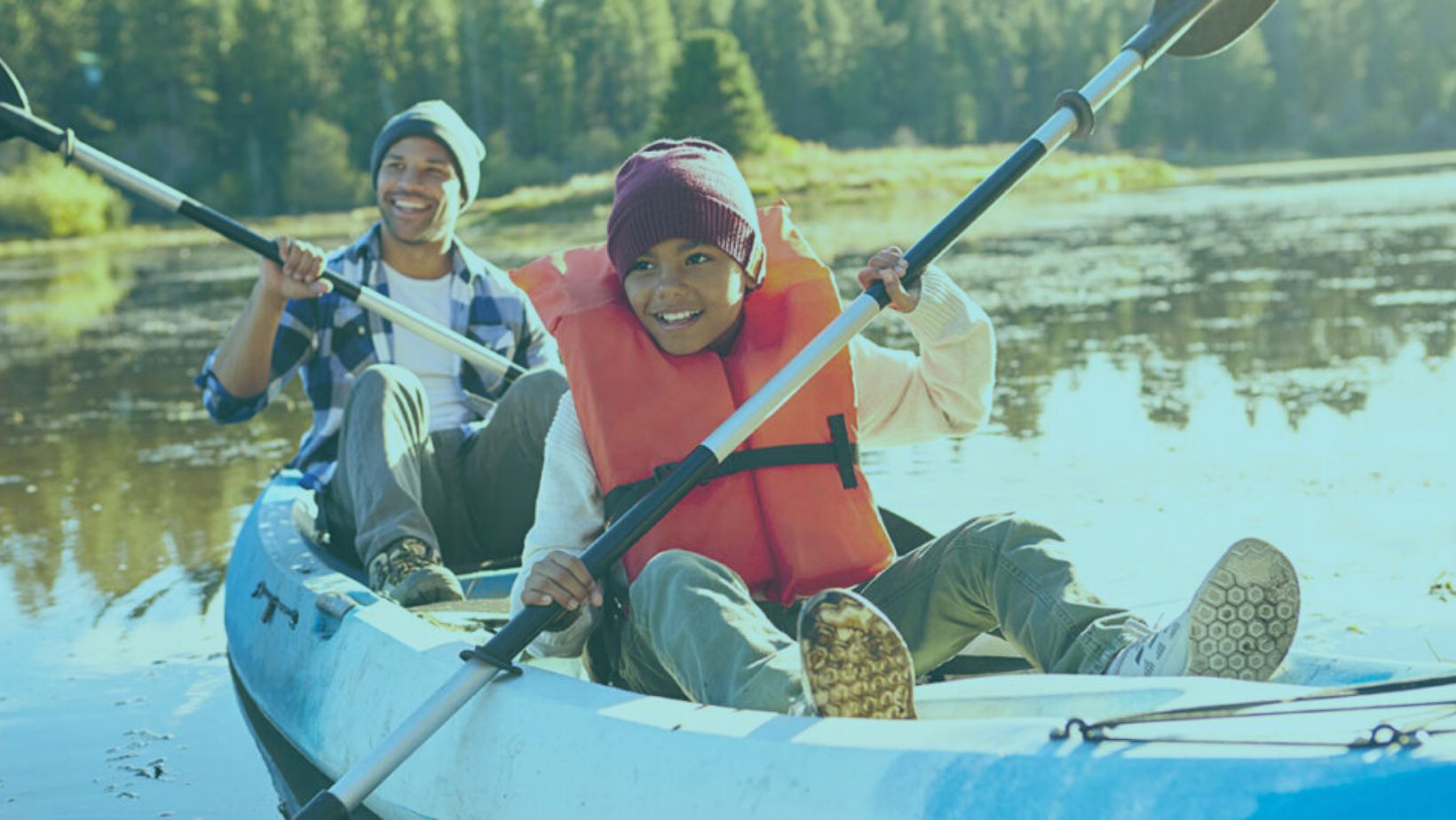 family kayaking on Deschutes River while renting on a family loving vacation rental of Bennington Properties